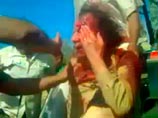 Единой версии гибели Каддафи нет. Появились видео, где раненного полковника избивает толпа