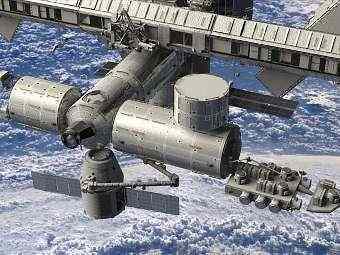Компьютерная модель корабля Dragon, пристыкованного к МКС. Изображение компании SpaceX